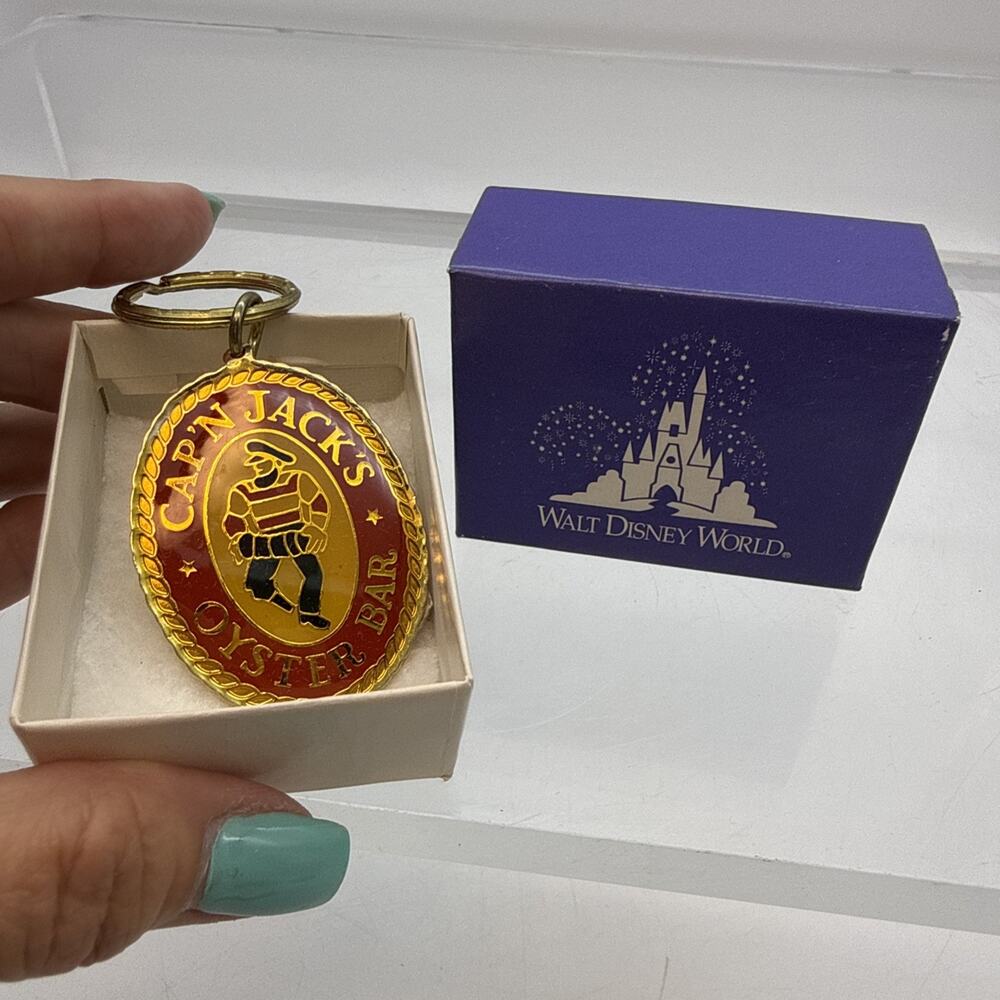 Rare Captain Cap’n Jack’s Oyster Bar Red Gold Disney Keychain - New With Tag